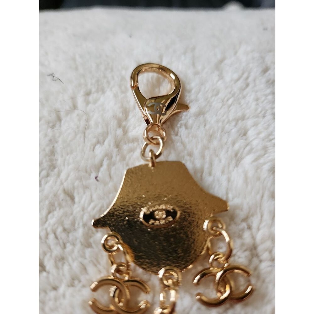 CHANEL Black and Gold Enamel Charm Doll with Pink Heart Sunglasses - Picture 6 of 7